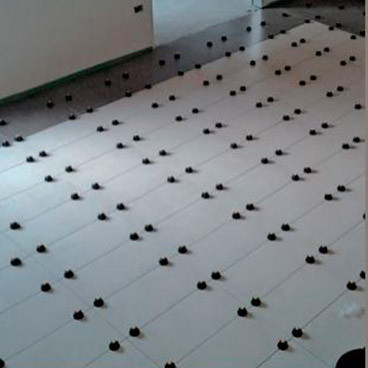 Leveling system for floor tiles